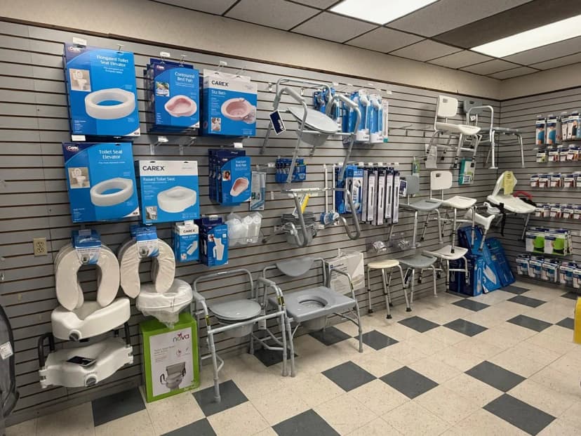 Smiling pharmacist helping customer